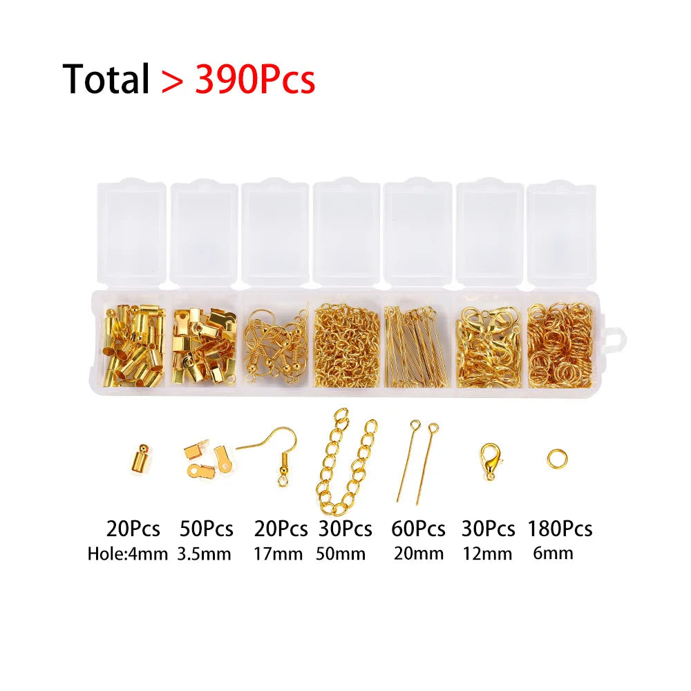 A set of jewelry making components including various sizes of jump rings, lobster clasps, and crimps in gold-colored metal.