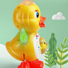 A yellow interactive dancing duck toy with bright eyes and a red foot, set against a light green background.
