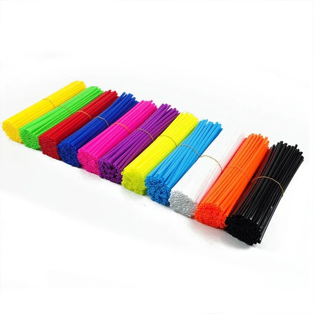 A collection of 36 motorcycle wheel spoke cover wraps in various bright colors including yellow, green, red, purple, and oran