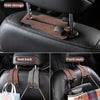 Close-up of a car seat with hidden storage hooks for bags and items, showing the suede hooks on the backrest.