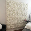 A white silk rose flower wall panel used for weddings and events.