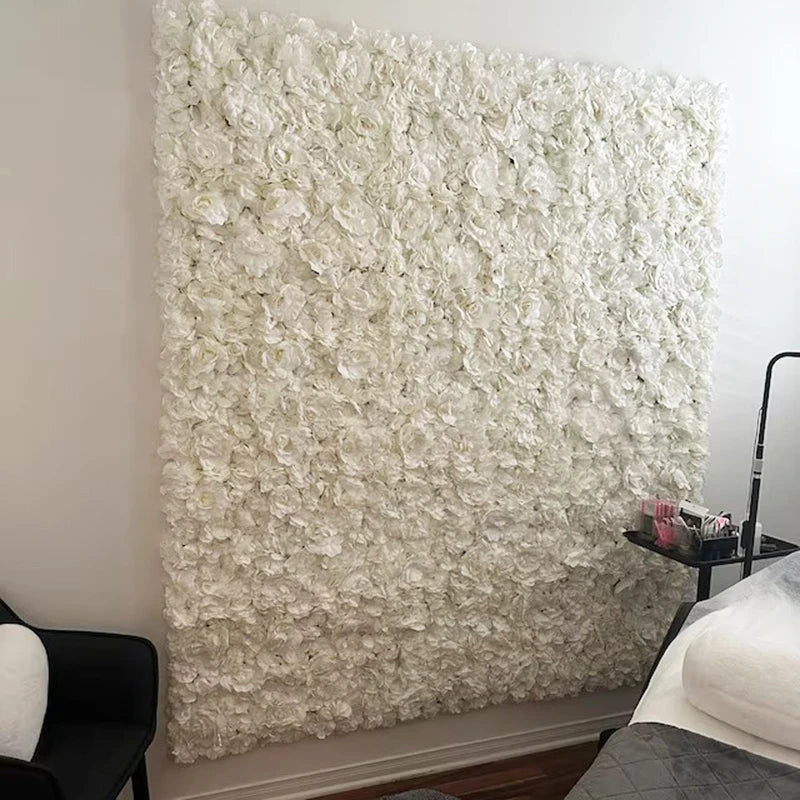 A white silk rose flower wall panel used for weddings and events.