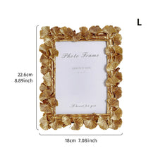 Elegant golden ginkgo leaf resin photo frame with a white background and a heart for you message