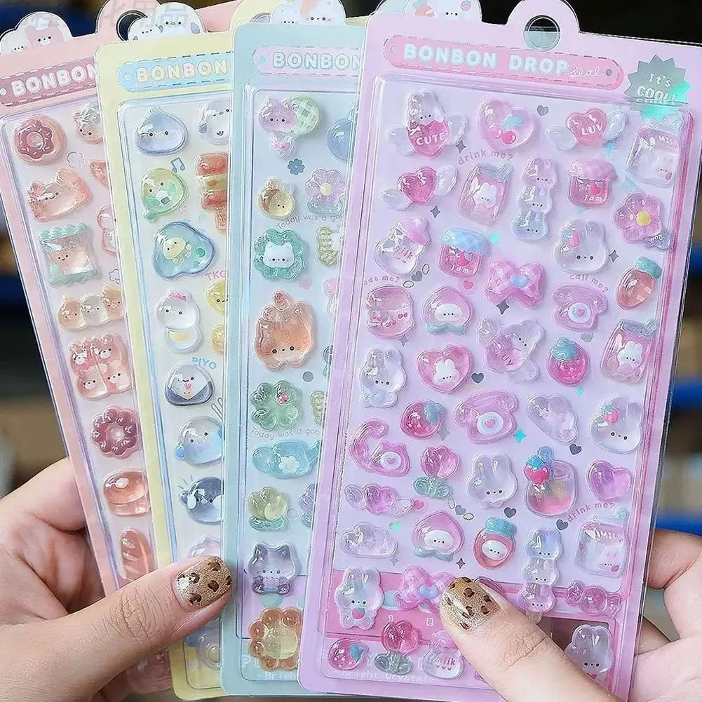A hand holds a pack of Bonbon Drop 3D jelly stickers featuring cute cartoon animals and ghost rabbits.