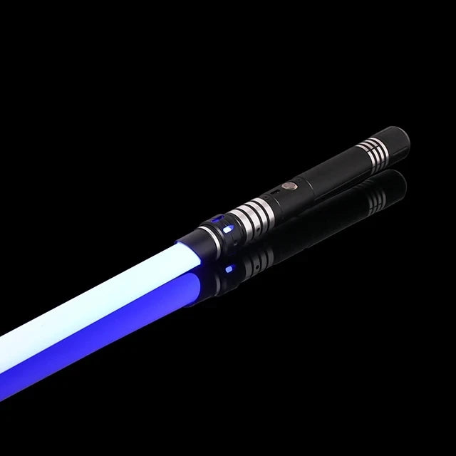 A black lightsaber with a blue glow tip and silver accents against a dark background.