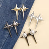 A collection of gold and silver Y2K star-shaped waist tightener clips for jeans displayed on a light background.