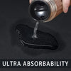 A hand pours liquid onto a black diatomite mat, demonstrating ultra absorbability.
