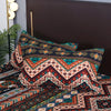 Boho striped geometric duvet cover set with patterned pillowcases featuring earthy tones and tribal designs