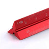 A close-up view of a red precision aluminum triangular scale ruler marked with measurements.