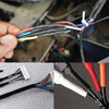 A close-up of various colored heat shrink tubing, including red and black, being held by a hand.