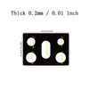 A black silicone mat with various sized circular cutouts for protecting a gas stove.