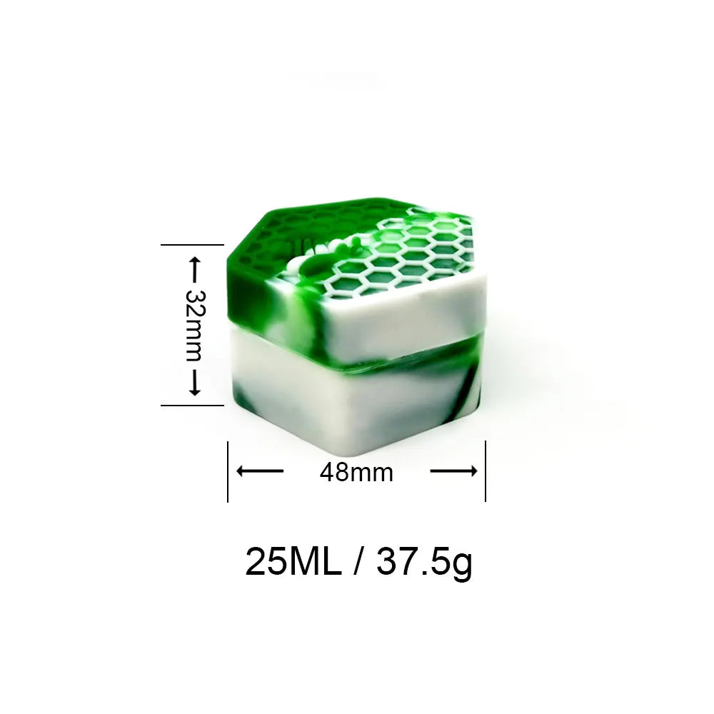 A green hexagonal silicone travel jar with a white base and a clear lid, measuring 32mm high and 48mm long.