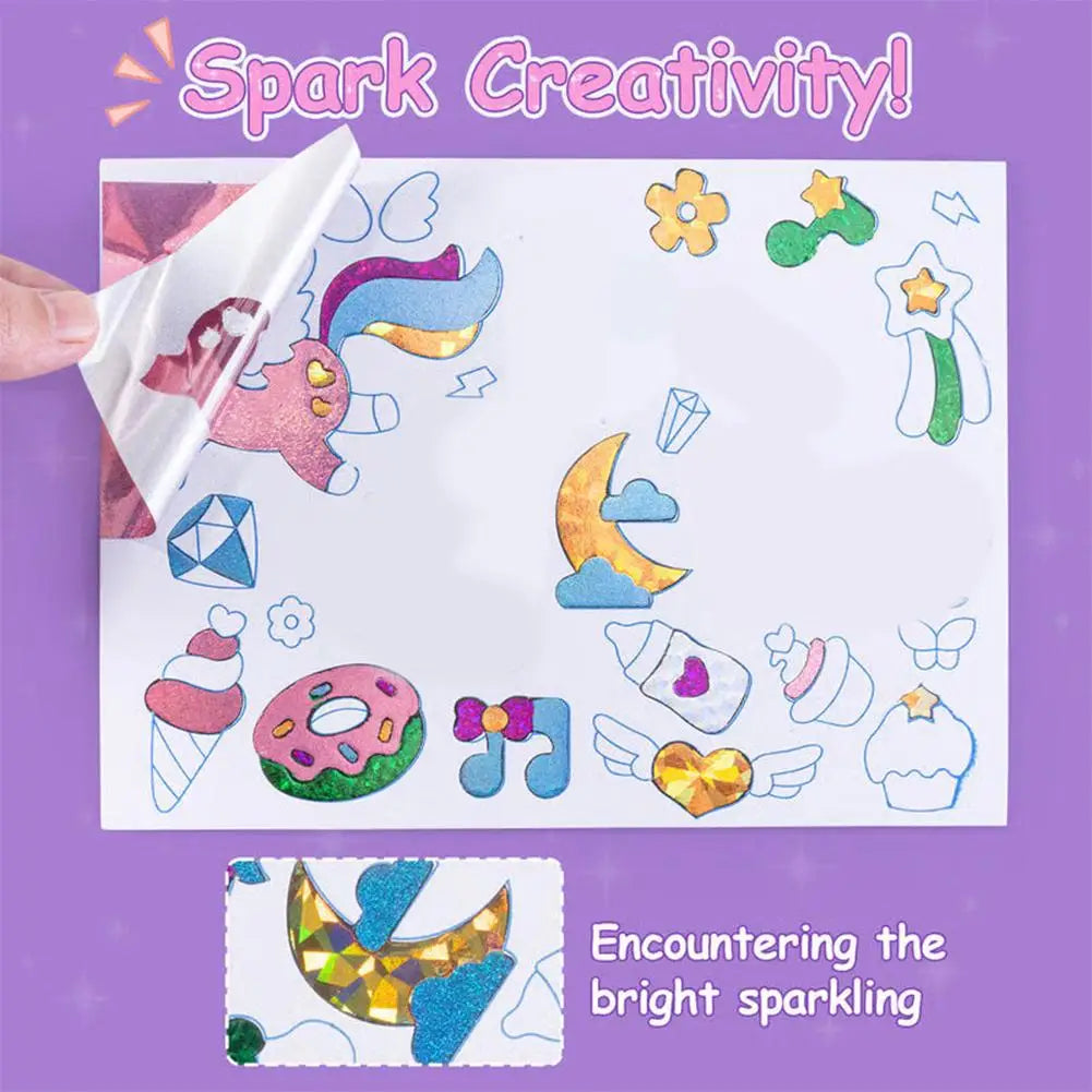 A white art sheet with colorful foil stickers and a hand holding a piece of the paper.