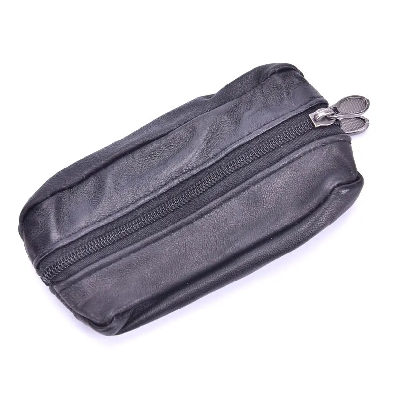 Black leather compact zippered coin purse with a metal key holder attached.