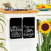 Two black kitchen towels featuring the slogan The kitchen is the heart of the home