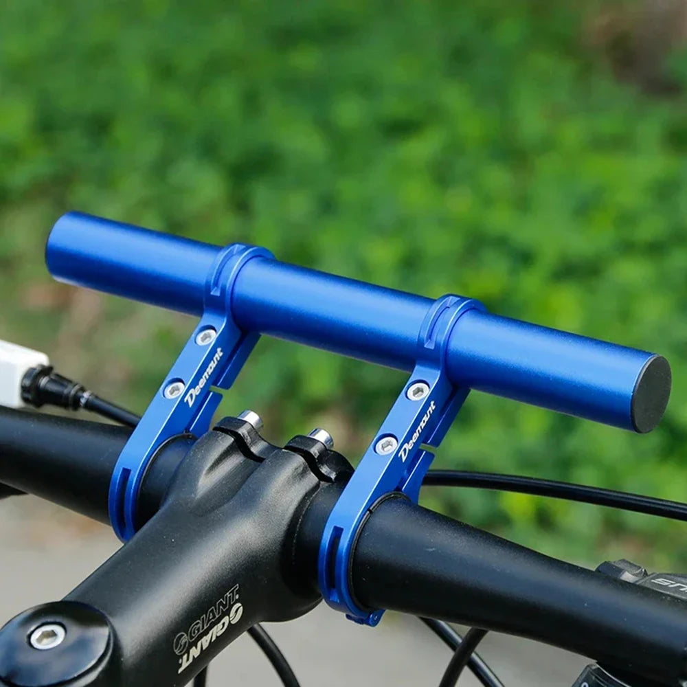 A blue aluminum alloy bicycle handlebar extender mount attached to a black bike handlebar.
