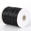 A spool of black waxed cord rope used for jewelry making and DIY projects.