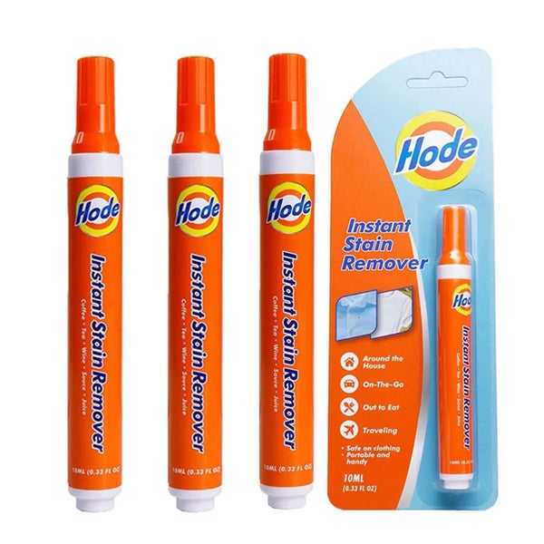Un set de rotuladores instantáneos para quitar manchas, en naranja y blanco, empaquetados en un contenedor de plástico transp