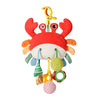A colorful hanging baby rattle and teether toy with a red crab pendant and various fruit-shaped components.