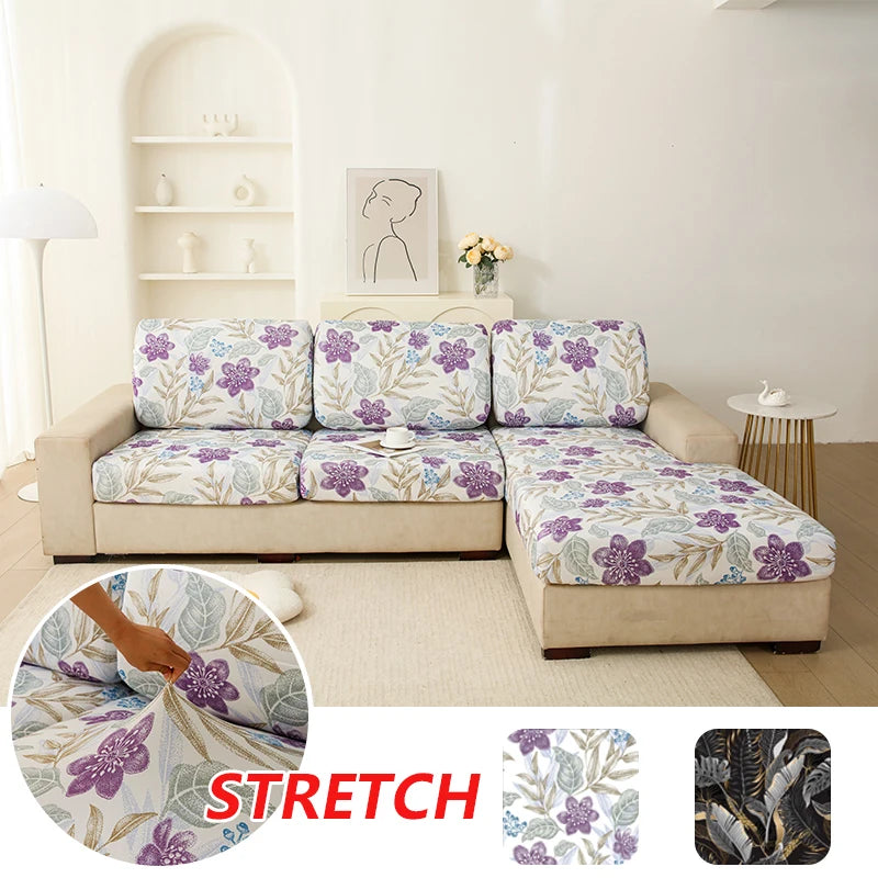 Floral elastic sofa cover showing a purple and green floral pattern on a beige sofa cushion.