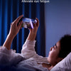 A person is looking at a phone screen, illustrating the effect of anti purple light on eyesight.