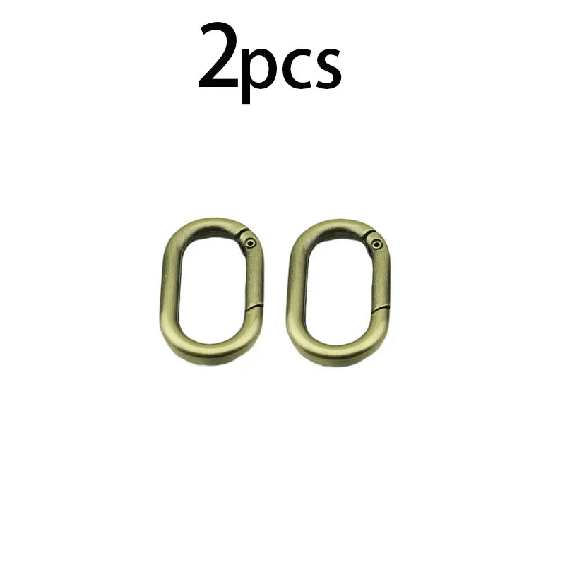 Zwei ovale federförmige O-Ring-Schnallen für Taschen und Gürtel