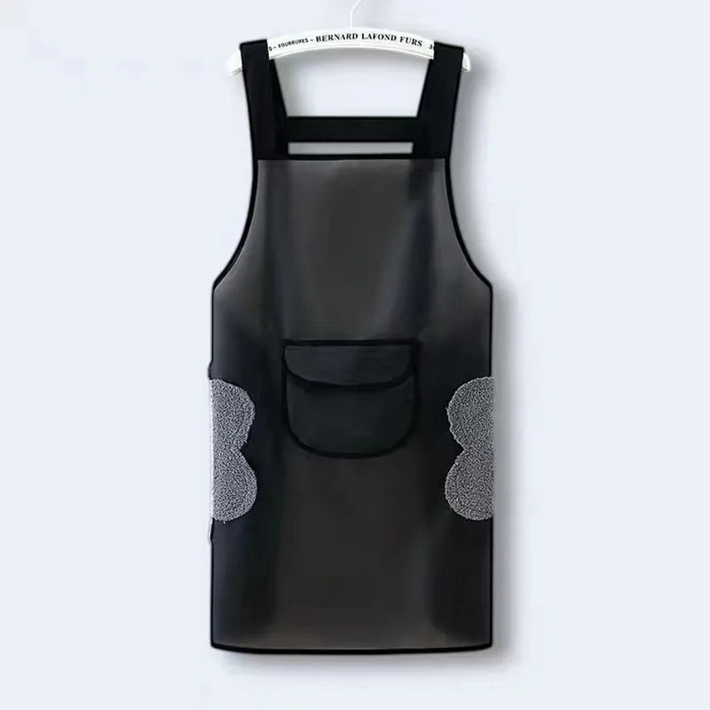 Black waterproof oil-proof kitchen apron hanging against a white background