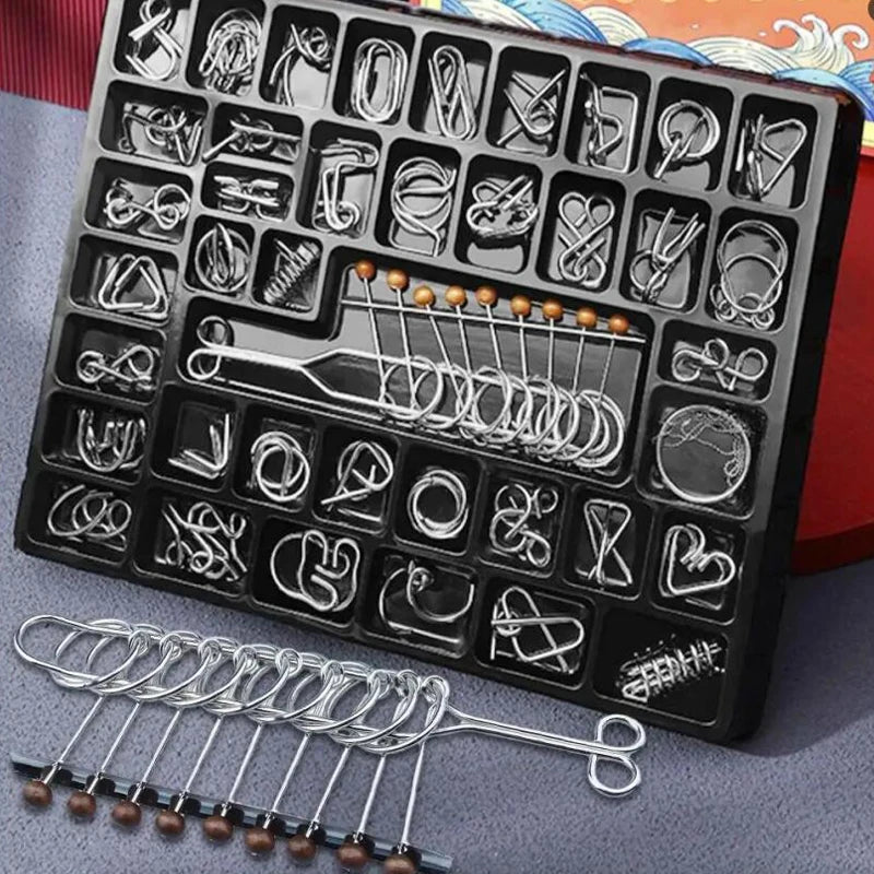 A black puzzle board containing numerous metal wire puzzles and a separate set of loose wires.