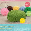 A collection of soft, bright colored acrylic yarn skeins including pink, yellow, blue, and green yarns.