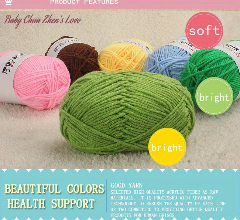A collection of soft, bright colored acrylic yarn skeins including pink, yellow, blue, and green yarns.