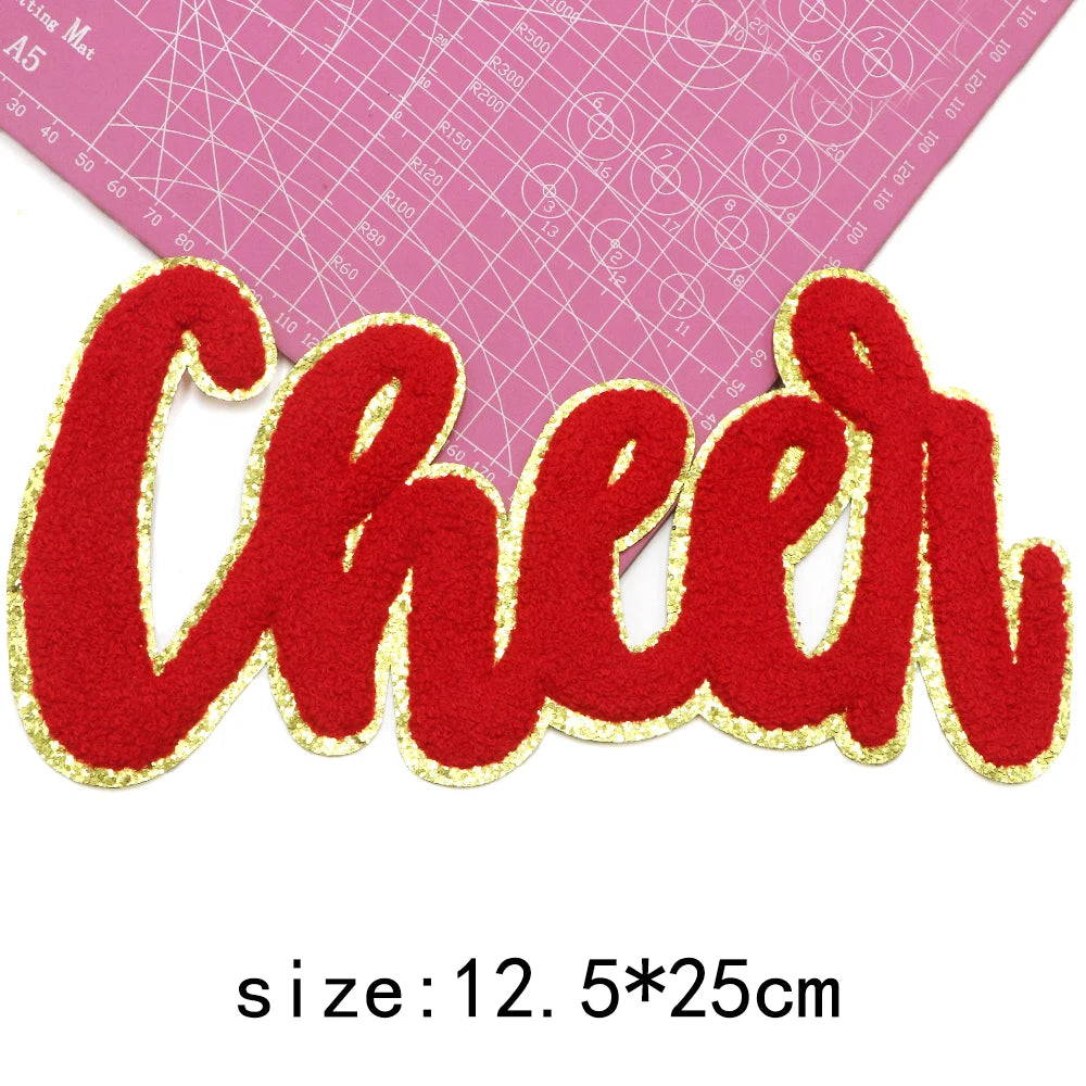 Red chenille letter patch spelling Cheer with gold glitter outline