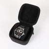 Black multi-slot watch travel organizer case with a comfort pillow and a wristwatch inside