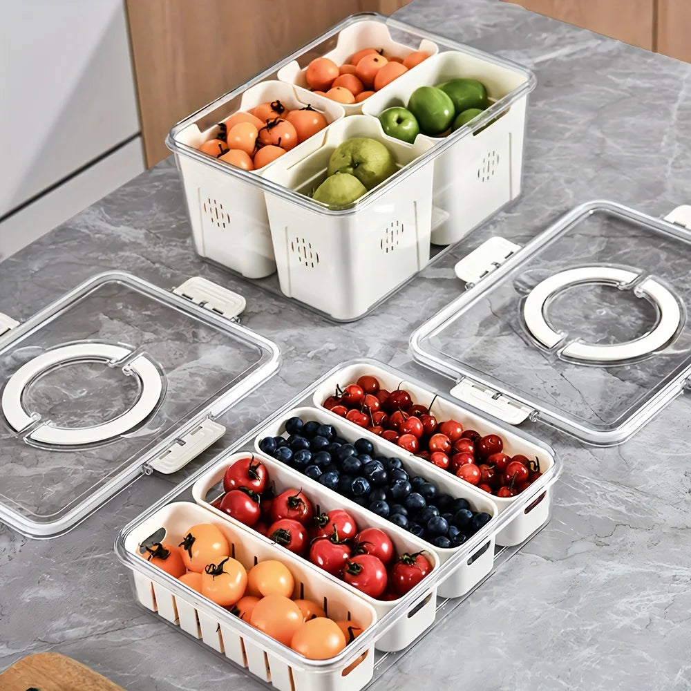 A white portable snack container with compartments holds various fresh fruits like apples, oranges, and berries.