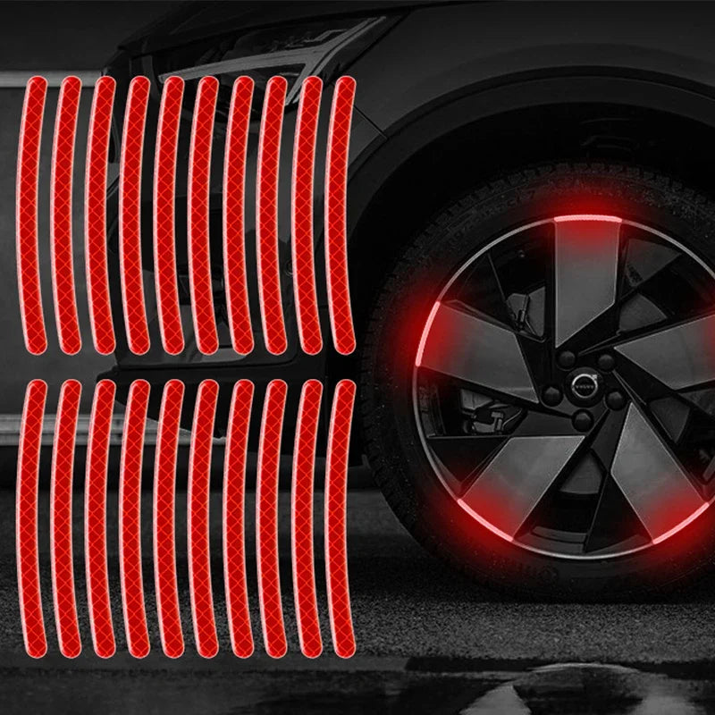Red reflective strips installed on a car wheel rim for enhanced visibility