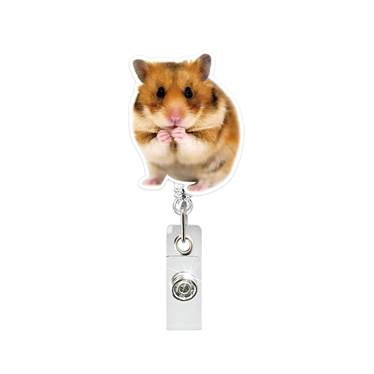A cute brown hamster is attached to a silver badge reel with an alligator clip.