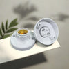 A white E27 screw cap light bulb holder with a gold-colored bulb visible inside.