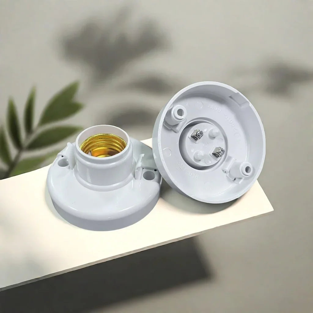 A white E27 screw cap light bulb holder with a gold-colored bulb visible inside.