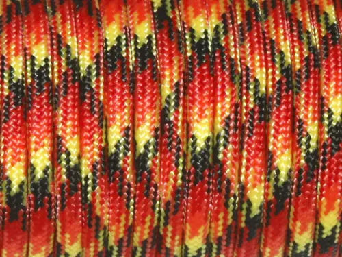Close-up of red paracord rope with black and yellow markings, showing the twisted strands.