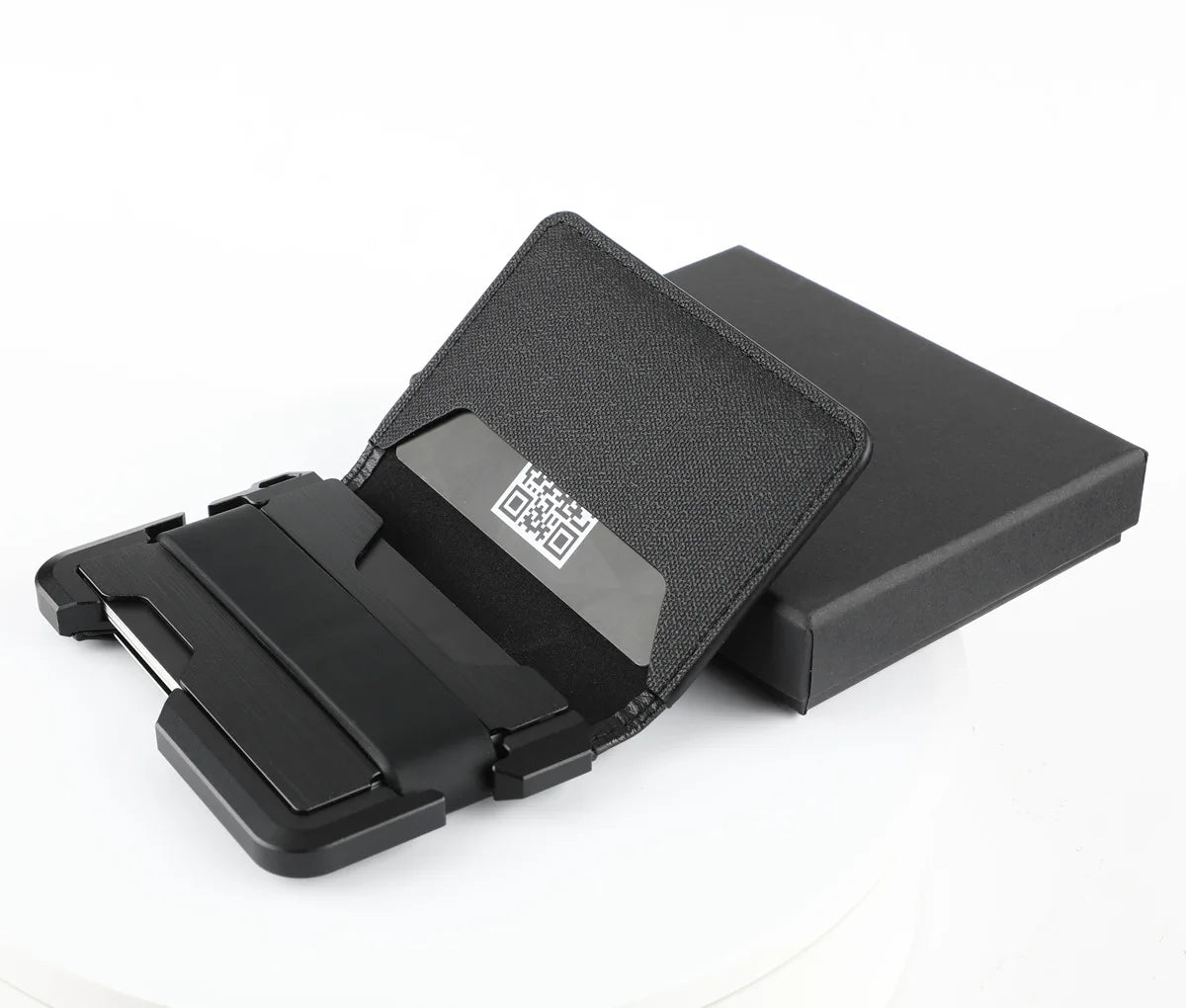 A black minimalist leather card holder with a bottle opener is shown open on a white background.