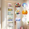Over-the-door hanging organizer with clear compartments holding various baby and cleaning supplies