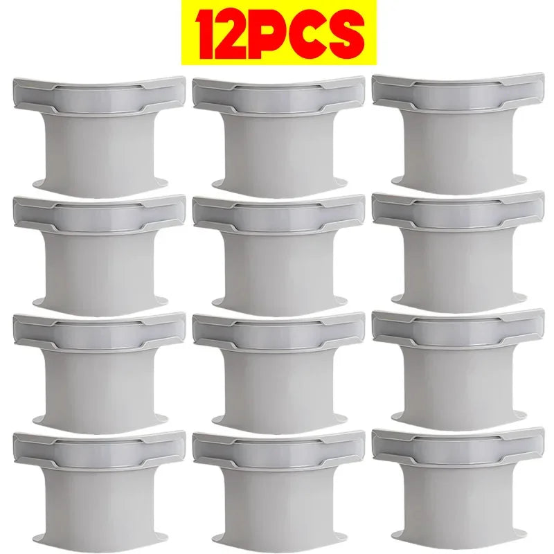Twelve white non-slip bed sheet fixing clips or straps for securing bedding.
