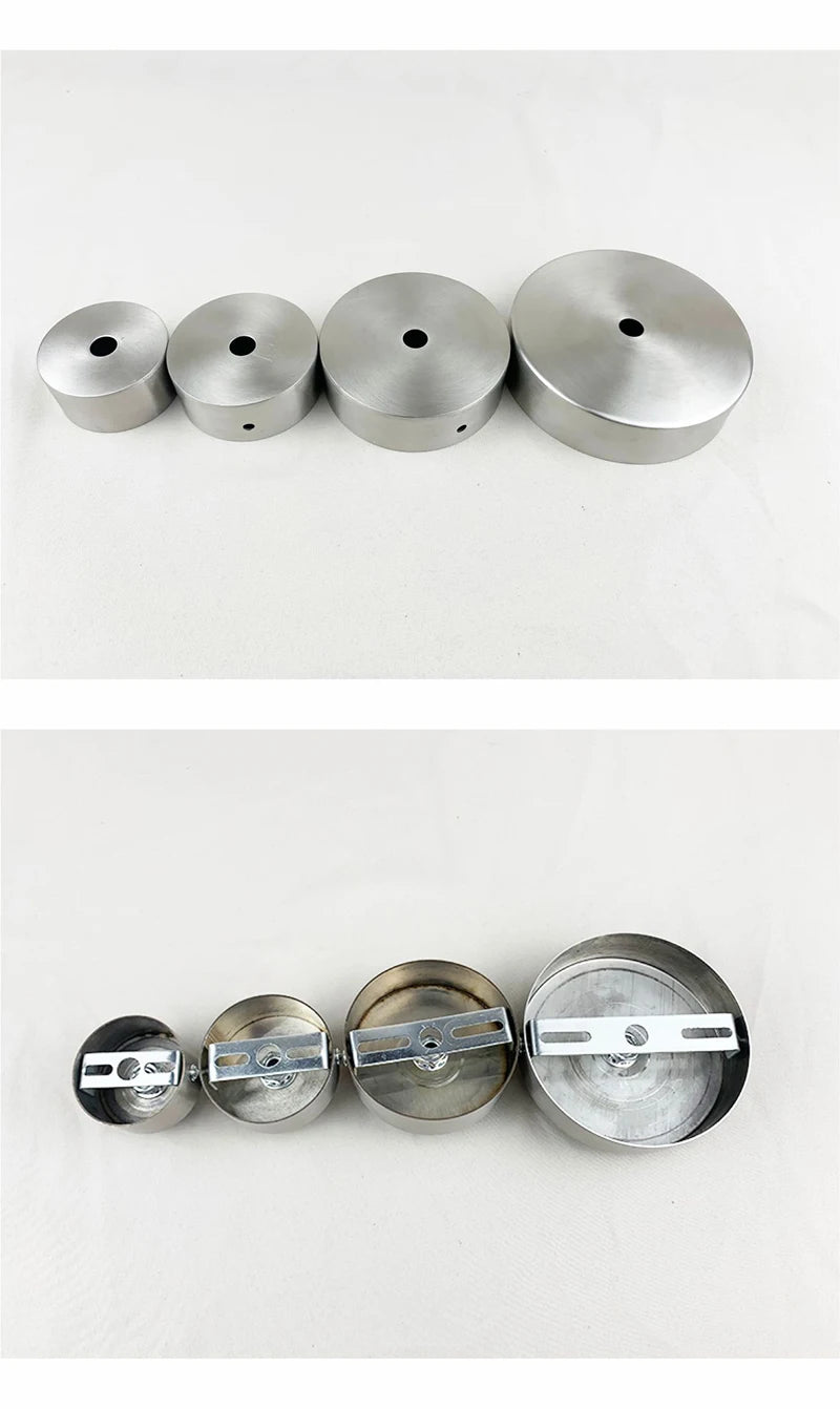 A row of five polished stainless steel ceiling mount canopy discs for pendant lights.
