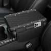Black diamond quilted car armrest cover with storage featuring a mounted smartphone.