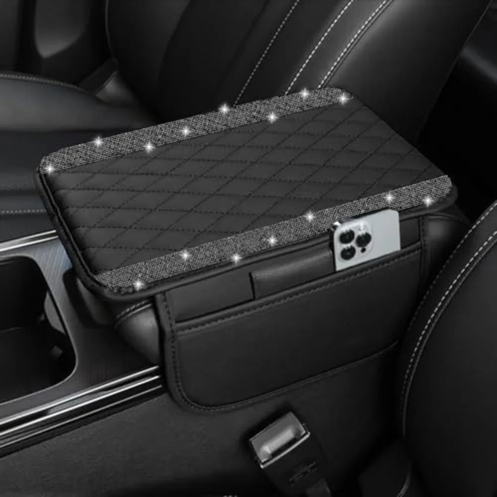 Black diamond quilted car armrest cover with storage featuring a mounted smartphone.
