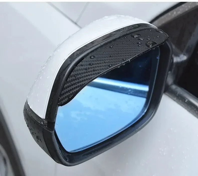 Close-up view of a black and white carbon fiber car side mirror rain and sun visor.