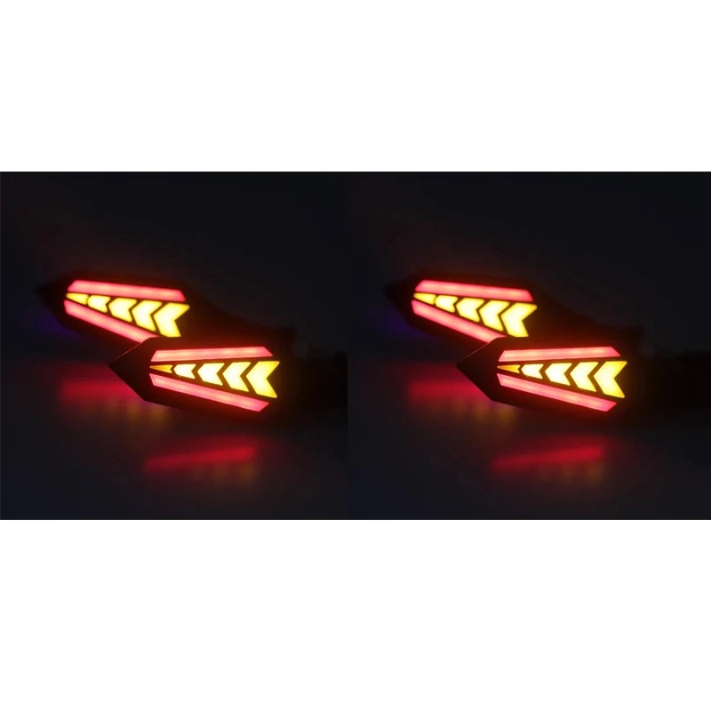 A pair of universal 12V motorcycle LED flowing turn signal indicators glowing red and yellow.