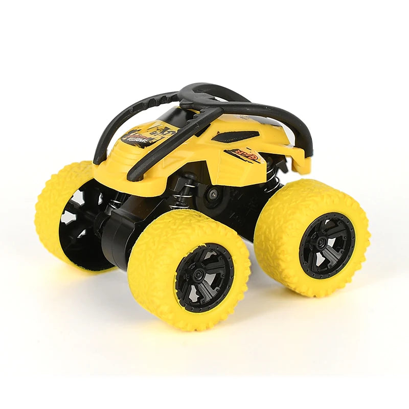 Yellow and black off-road stunt car with large tires and a steering wheel.