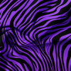 A close-up of a fabric with a bold purple and black zebra print pattern.