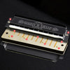 A black harmonica with ten holes and a case is shown, featuring numbered keys.