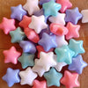 A pile of 50 colorful, non-toxic ball pit balls in various pastel shades including pink, purple, blue, and white.
